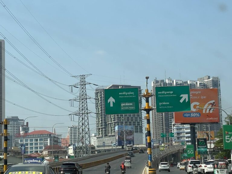 Road signs on the route from Phnom Penh International Airport (KTI) to Phnom Penh city centre during an airport transfer