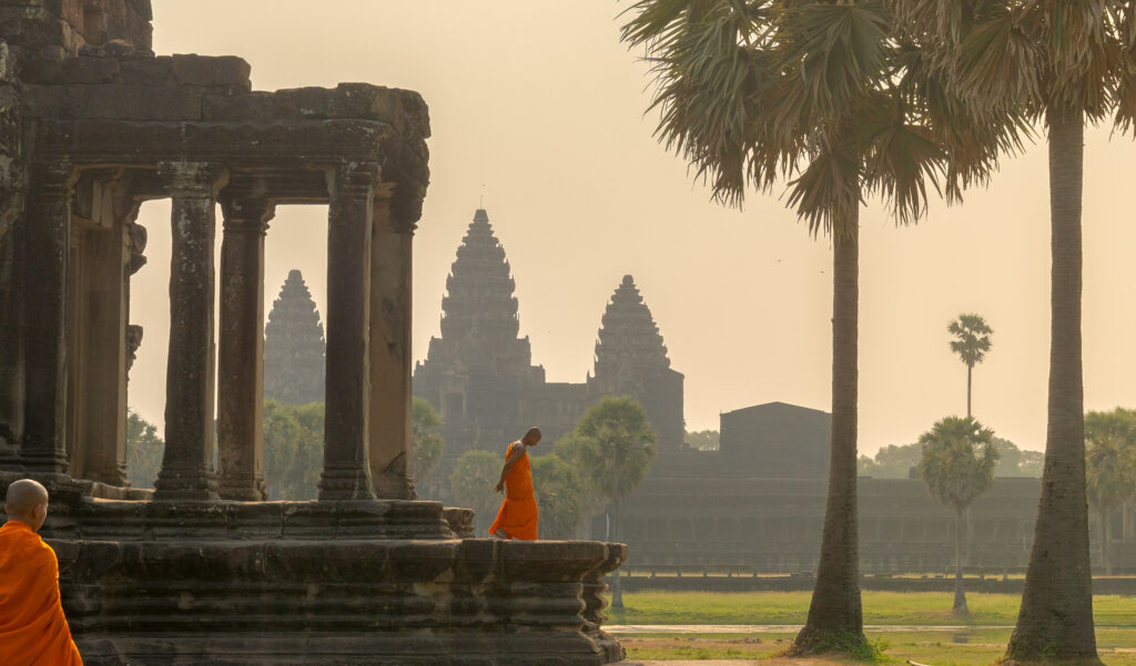 Monk at Angkor Wat Temple at sunrise